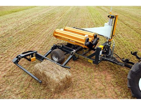 In stock With 13 HP pack. . Small square bale wrapper for sale